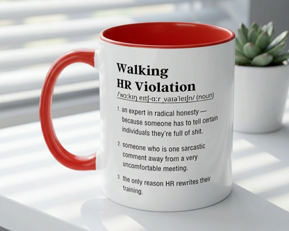 Mug with red interior and handle, featuring a definition of 'Walking HR Violation' on a white surface with a plant in the background.