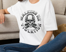Person wearing a white t-shirt with a graphic design sitting on a carpeted floor.