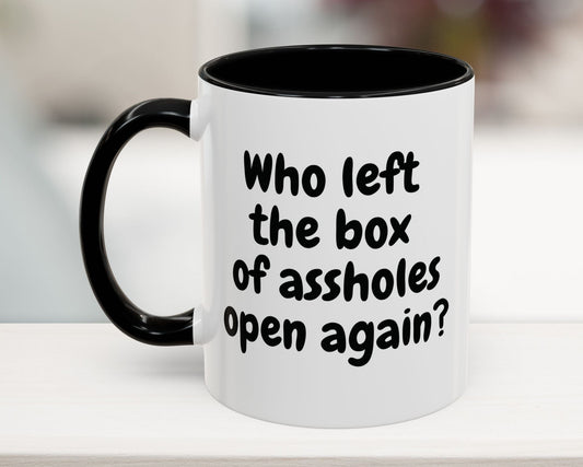 Black 11oz mug with “Who left the box of assholes open again?” quote