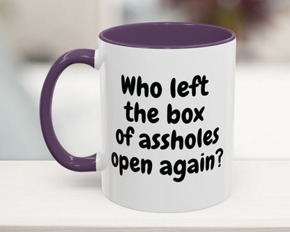 Purple 11oz mug with “Who left the box of assholes open again?” quote