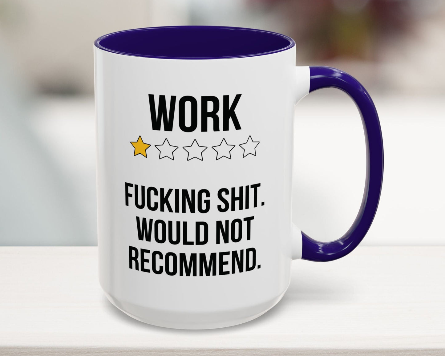 Mug with text and star ratings on a blurred background