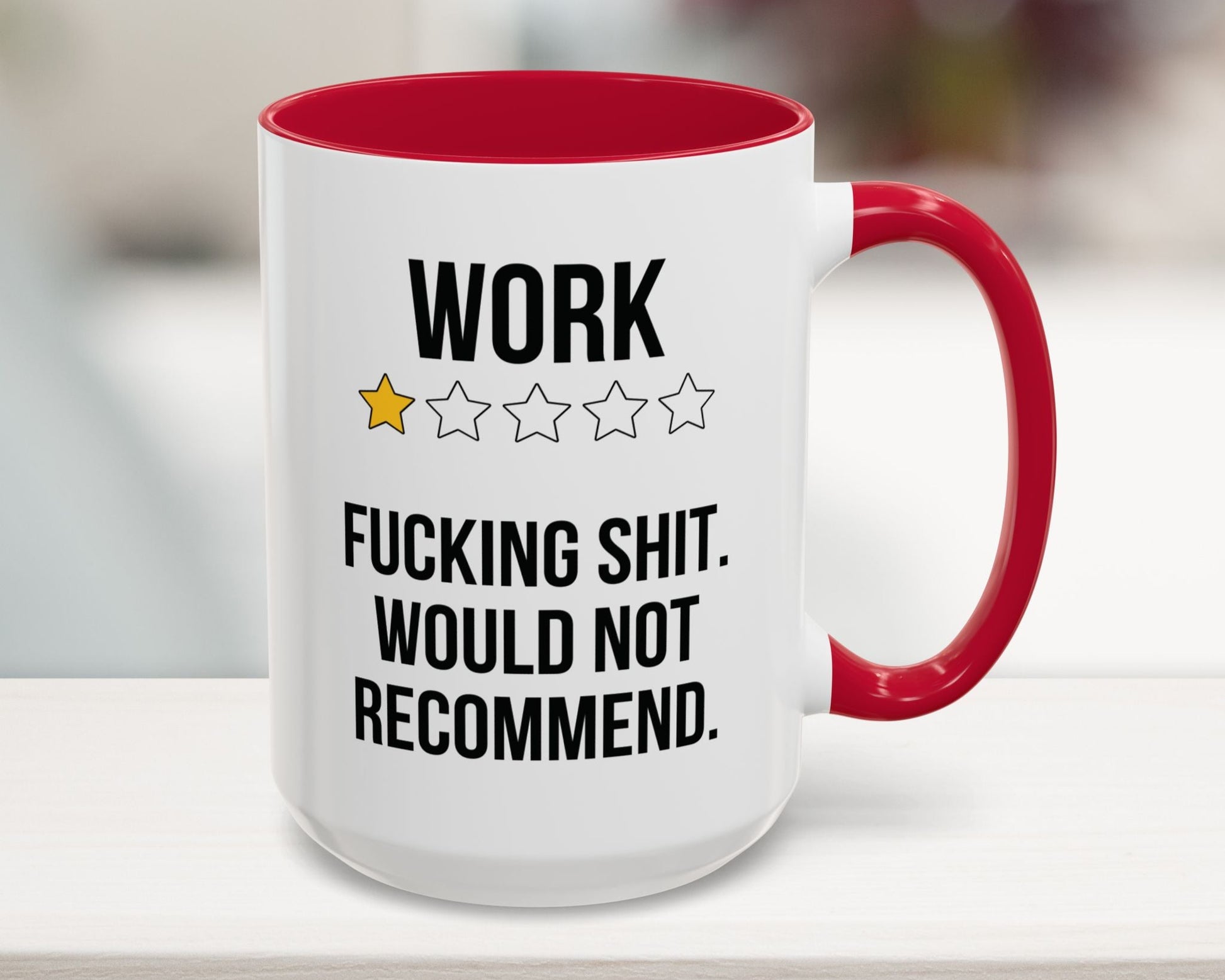 Mug with text and star ratings on a blurred background