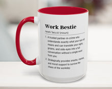 Mug with red interior and handle, featuring text on a blurred background