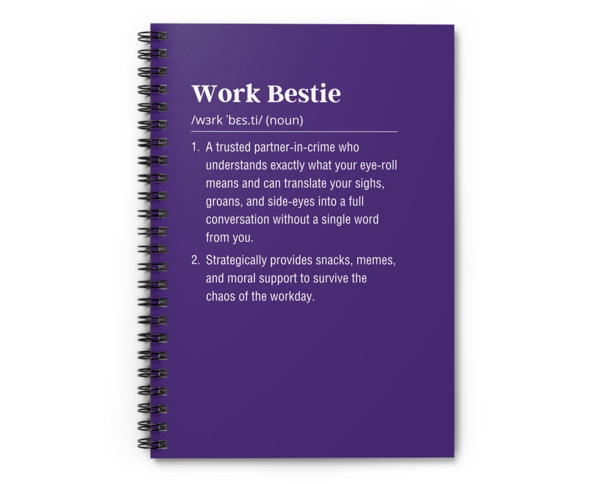 Purple notebook with text definition on a white background