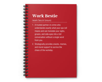 Red notebook with 'Work Bestie' definition on a white background