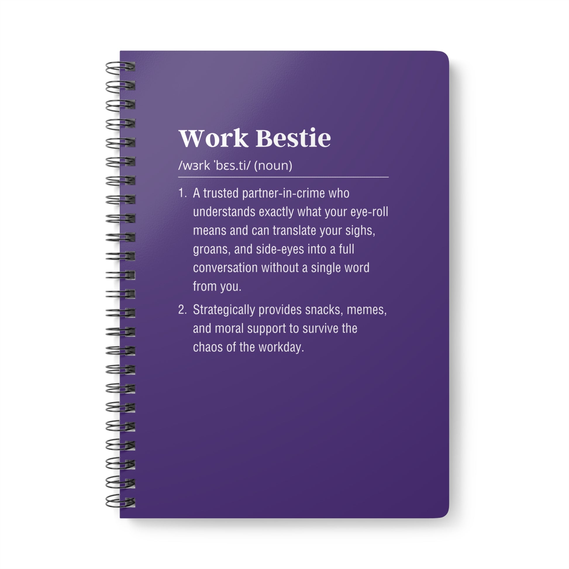 Purple notebook with text definition on a white background
