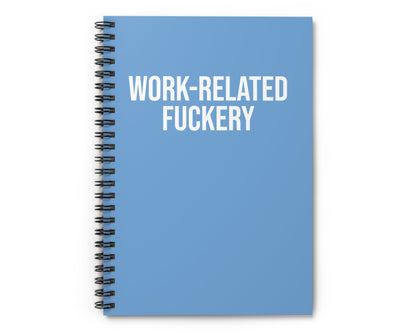 Blue notebook with 'WORK-RELATED FUCKERY' text on a white background