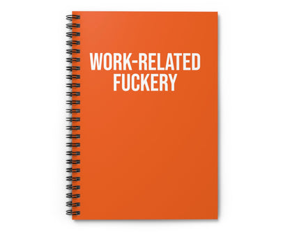 Orange notebook with 'WORK-RELATED FUCKERY' text on a white background