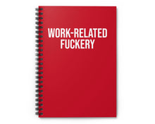 Red notebook with 'WORK-RELATED FUCKERY' text on a white background