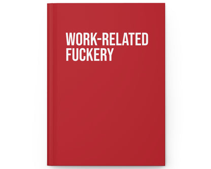 Red notebook with white text 'WORK-RELATED FUCKERY' on a white background